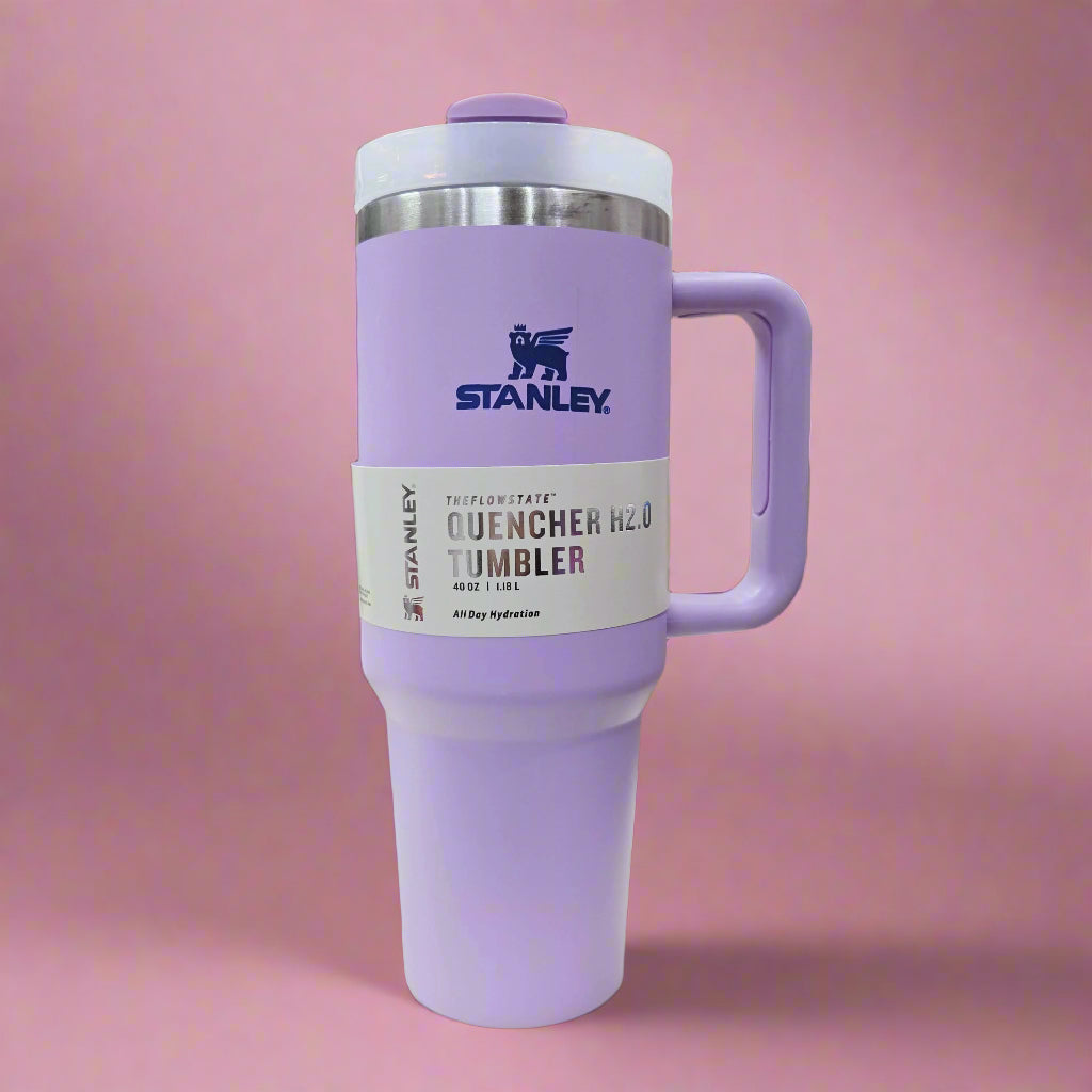 Purple Stanley tumbler with a handle in a store setting
