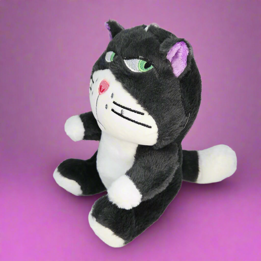 Plush toy of a black and white cat with purple accents on a light gray background