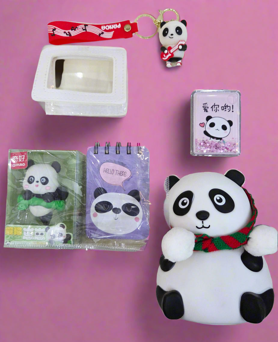 Collection of panda-themed stationery and accessories on a white surface