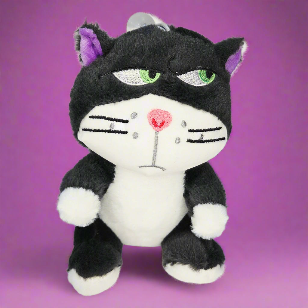 Black and white plush toy with purple accents on a light gray background