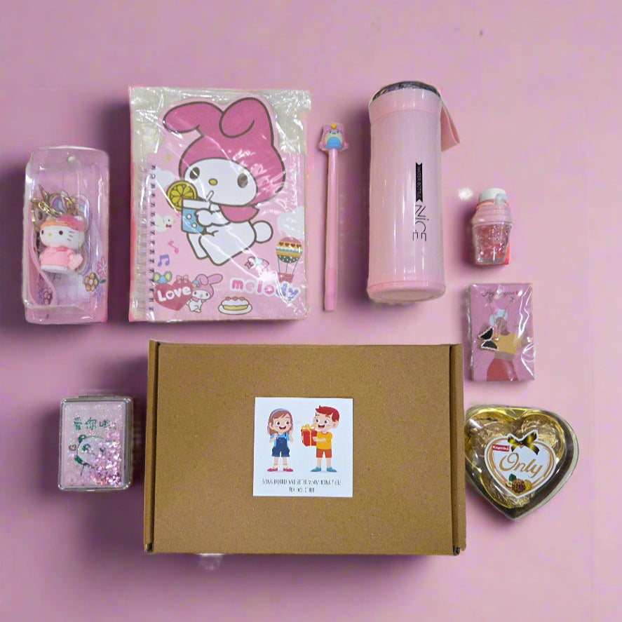 Collection of stationery items including a pink notebook, water bottle, and small figurines on a pink background.