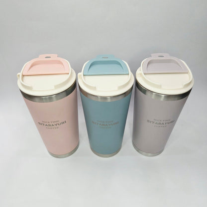 Three insulated travel mugs in gray, blue, and pink on a light gray background