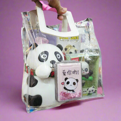 Panda-themed product set in a clear plastic bag held by a hand in a store setting.
